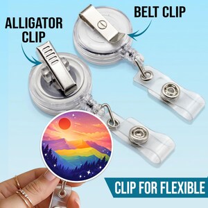 May include: Two retractable badge holders with clear plastic bodies and metal clips. One has an alligator clip, the other a belt clip. The badge reel features a colorful mountain landscape design. Text on the image reads "ALLIGATOR CLIP", "BELT CLIP", and "CLIP FOR FLEXIBLE".