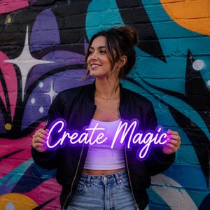 May include: A bright purple neon sign featuring the text Create Magic in a cursive script font. The sign is illuminated and emits a vibrant glow, showcasing the words clearly against the dark background of the black bomber jacket.