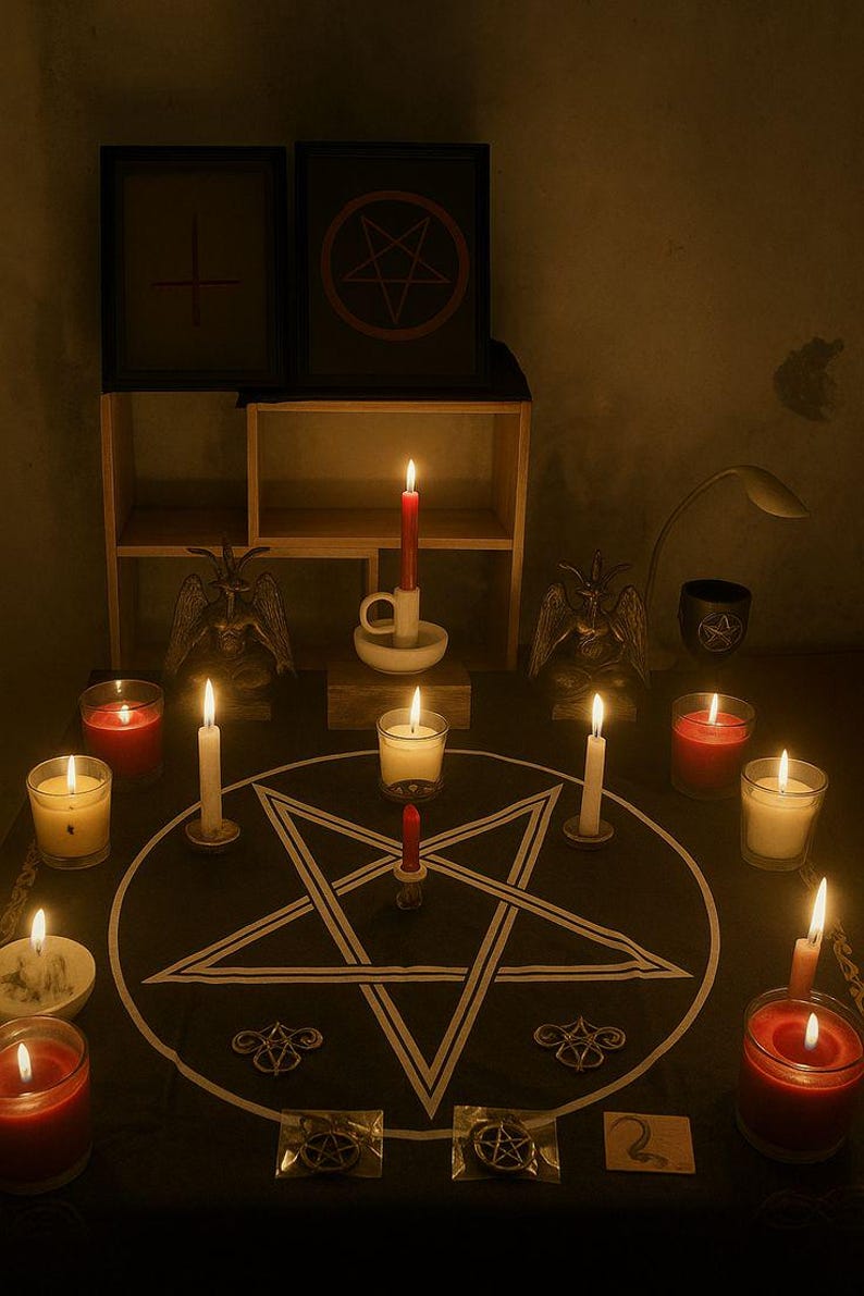 May include: A dimly lit scene featuring a black cloth with a white pentagram, surrounded by lit candles of various colors and sizes. Two framed images with symbols are on a shelf. Two Baphomet statues are present.