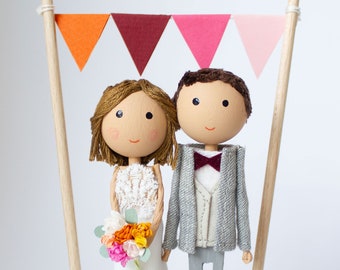 Wedding cake topper with bunting - personalized and adapted to the look of the bride and groom