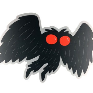 May include: Black and white sticker of a moth with large red eyes. The moth has feathery wings and a fuzzy body.