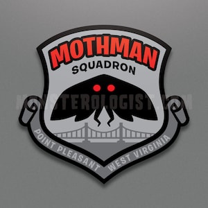 May include: A black and gray patch with a mothman silhouette, red eyes, and the text "Mothman Squadron" above the mothman. The text "Point Pleasant West Virginia" is on a scroll below the mothman.