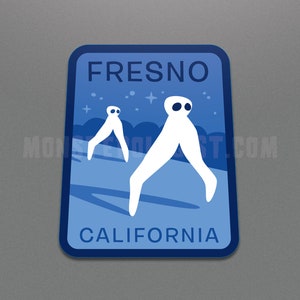 May include: Blue and white sticker with the text "FRESNO CALIFORNIA" and a graphic of two white aliens walking on a blue surface with stars in the background.