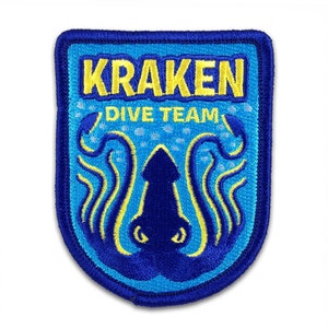 May include: Blue and yellow embroidered patch with a kraken, tentacles, and the text "Kraken Dive Team".