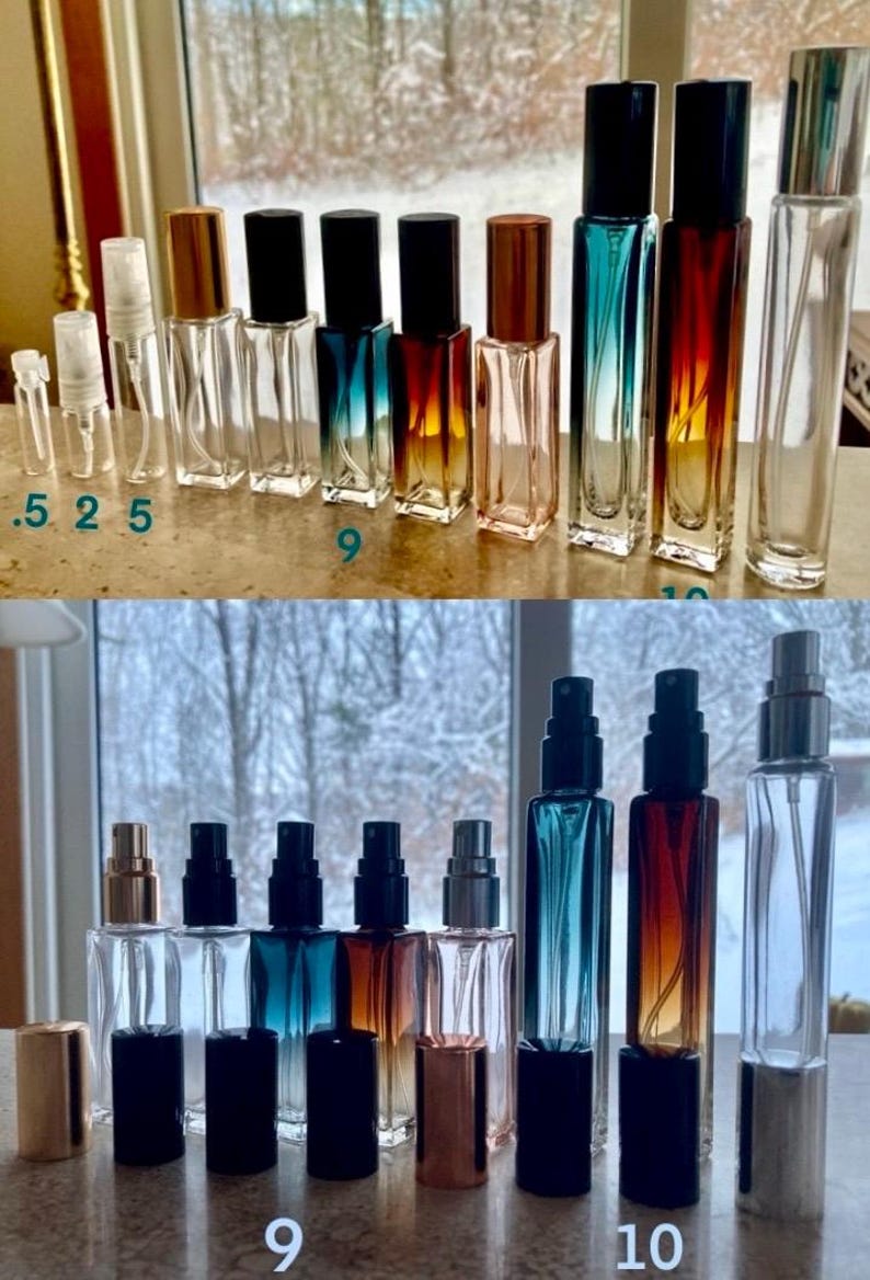 May include: Collection of glass perfume bottles in various sizes and colors. The bottles have different colored spray tops and some have metallic caps. The bottles are labeled with numbers .5, 2, 5, 9, and 10.
