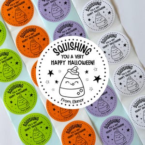 May include: A collection of round adhesive stickers in orange, purple, green, and white. Each sticker features a cartoon candy corn character wearing a witch hat, surrounded by stars, with the text SQUISHING YOU A VERY HAPPY HALLOWEEN! From, Ellanor.
