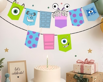May include: A decorative party banner featuring pennants with monster-themed illustrations, including a green one-eyed character, a blue furry face, a pink door, a purple monster with white hair, and blue polka-dot patterns strung on a black cord.