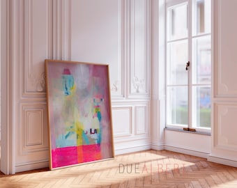 May include: Abstract art print in a wooden frame. The artwork features a vibrant mix of colors, including pink, blue, yellow, and orange. The painting leans against a white wall in a room with a large window and hardwood floors. The text "DUE ALBERTI" is visible.