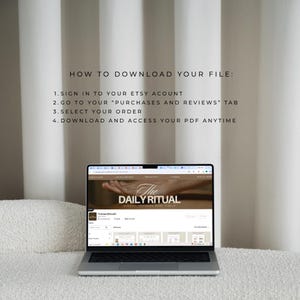 May include: A laptop displaying "The Daily Ritual" website, with instructions on how to download a file from Etsy. The screen shows a website with a hand holding a leaf. The text reads: "HOW TO DOWNLOAD YOUR FILE:" followed by numbered steps.