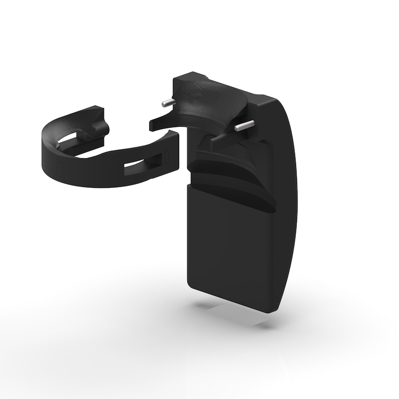 May include: A black plastic component, possibly a part of a larger mechanism, is shown against a white background. The component is composed of several connected pieces, including a curved bracket and a rectangular section.