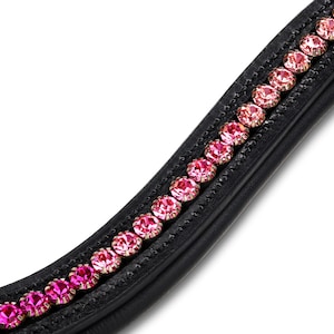May include: Black leather horse bridle browband with a row of pink and rose-colored crystals. The crystals are set in a curved line along the browband. The browband is designed for equestrian use.