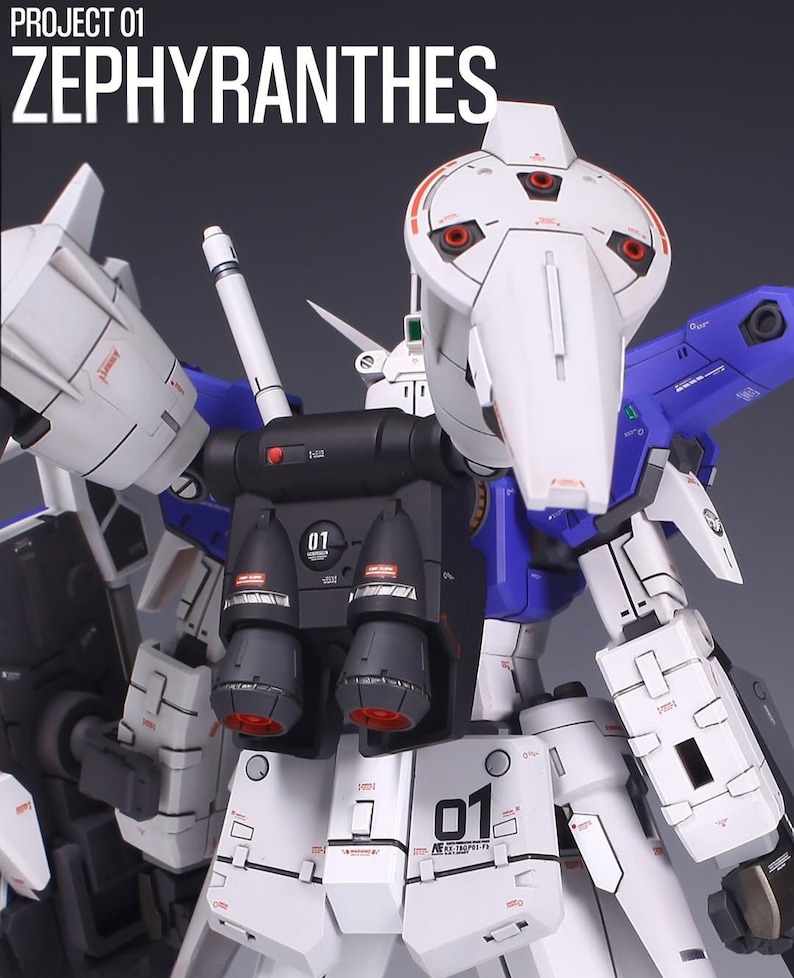 May include: A detailed, close-up view of a white, blue, and black model robot. The model has intricate mechanical details, including thrusters, vents, and the number "01" printed on various sections. The text "PROJECT 01 ZEPYHRANTHES" is at the top.