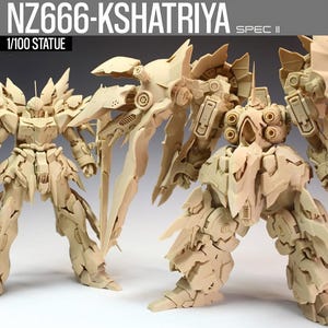 May include: A beige 1/100 scale statue of the NZ666-Kshatriya Spec II, a detailed model of a mecha robot. The model has intricate armor and wing-like structures. The text "NZ666-KSHATRIYA SPEC II" and "1/100 STATUE" are visible.