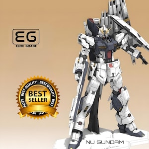 May include: A white and navy Nu Gundam model kit with a large back unit and a long rifle. The model is standing on a white base. The image includes the text "ELITE GRADE" and "BEST SELLER".