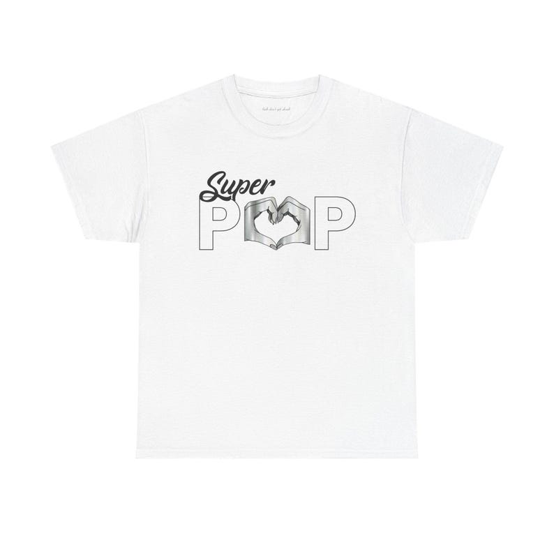 May include: White t-shirt with the words "Super POP" in black script and block letters. The "O" in "POP" is a heart shape. The shirt is made of a soft material.