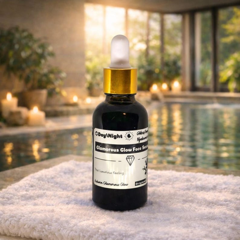 This bottle represents the core treatment step of your Glamorous Glow skincare routine — a concentrated facial serum designed to deeply hydrate, smooth, and visibly refresh the skin.

Presented in a luxury dark glass dropper bottle with gold detailing, this formula protects delicate active ingredients while delivering precision application for maximum skin absorption.