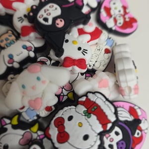 May include: A set of three ceramic vases in varying heights. The vases have a matte finish in shades of cream, beige, and brown. The tallest vase is approximately 10 inches high.