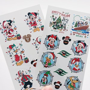 May include: Two sheets of Disney-themed Christmas stickers featuring Mickey Mouse, Minnie Mouse, Donald Duck, Daisy Duck, and Goofy in holiday attire. The designs include characters wrapped in string lights, wearing Santa hats, and a cruise ship graphic with the text Merrytime Cruise.