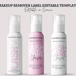 May include: Three cylindrical pump bottles for makeup remover with editable labels. The bottles feature text including BUSINESS NAME, MAKEUP REMOVER, LASH WASH, LASH CARE CLEANSER, and 2 OZ | 50 ML. The labels are white and pink with black and pink typography.