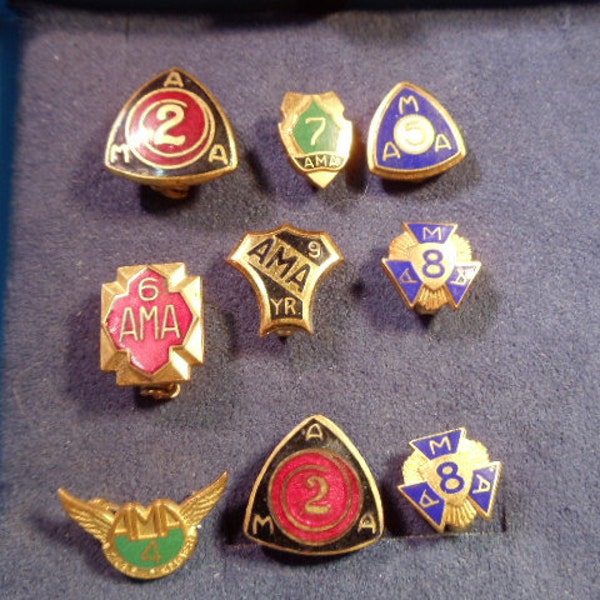 Group of 9 Vintage American Motorcycle Association AMA Lapel or Hat Year Pins