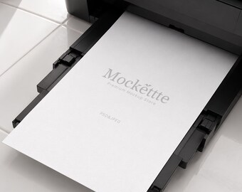 A4 Paper in Black Printer Mockup | Editable PSD & JPEG | 2000x2000 px | 300 DPI | Minimal Office Branding Scene | For Flyers