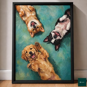 May include: A framed oil painting featuring three dogs lying on their backs on a textured teal surface. The dogs include a golden-brown dog, a black and white dog, and a light golden puppy, all depicted with visible brushstrokes and happy expressions.