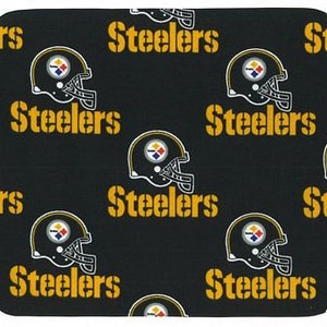May include: Black mouse pad with a repeating pattern of yellow "Steelers" text and a black and yellow football helmet.