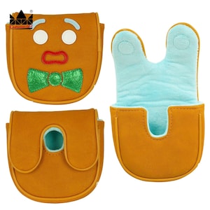 K&ouml;nnte beinhalten: Golfschl&auml;gerhauben-Set im Lebkuchenmann-Design. Die Bez&uuml;ge sind braun mit wei&szlig;en, roten und gr&uuml;nen Akzenten. Die Innenseite ist hellblau. Das Set enth&auml;lt eine H&uuml;lle mit Gesicht, eine H&uuml;lle mit Klappe und eine H&uuml;lle mit U-f&ouml;rmiger &Ouml;ffnung.