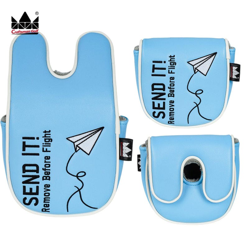 K&ouml;nnte beinhalten: Hellblaue Golf-Putter-Schl&auml;gerhauben mit wei&szlig;er Umrandung und dem Text "SEND IT! Remove Before Flight" sowie einer Papierflieger-Grafik. Die Hauben haben ein U-f&ouml;rmiges Design und ein Craftsman Golf-Logo.