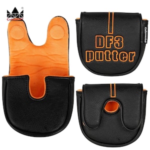 K&ouml;nnte beinhalten: Schwarze Golf-Putter-Schl&auml;gerhaube mit orangefarbenen Akzenten. Der Schriftzug "DF3 putter" ist orangefarben. Die Innenseite ist orange. Das Craftsman Golf-Logo ist sichtbar.