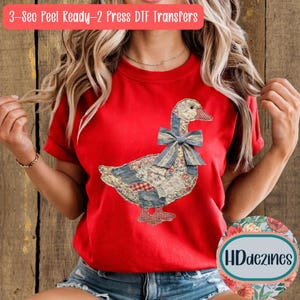May include: A red t-shirt featuring a patchwork goose design with a blue gingham bow. The goose is made of various fabric patterns. The text "3-Sec Peel Ready-2 Press DTF Transfers" is at the top. The shirt has short sleeves.