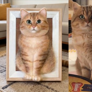 May include: A framed, three-dimensional felted cat portrait. The cat is a golden tabby with green eyes, and the portrait is set in a light-colored wooden frame. The cat is also shown in a separate image.
