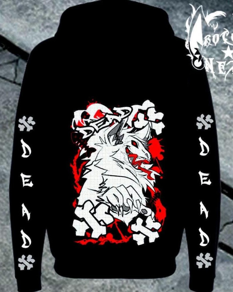 Puede incluir: Una sudadera negra con capucha que presenta un gr&aacute;fico de una criatura blanca similar a un lobo con ojos y detalles bucales rojos. La palabra DEAD est&aacute; impresa en blanco en ambas mangas, y el gr&aacute;fico trasero incluye la palabra DEAD sobre la criatura.