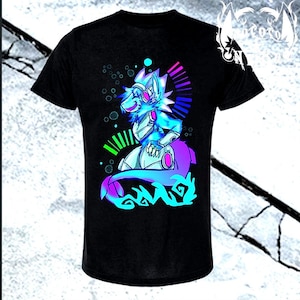 May include: A black short-sleeve t-shirt featuring a vibrant graphic of a stylized anthropomorphic creature with blue and purple fur, wearing headphones. The design includes neon green and pink accents, circular patterns, and a tail.