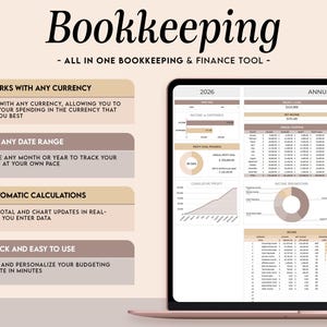 May include: A digital bookkeeping and finance tool displayed on a tablet. The screen shows financial data, charts, and graphs. Text on the screen includes "2026" and "Annual Dashboard." Additional text highlights features like currency compatibility and automatic calculations.