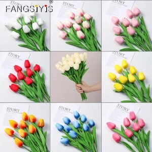 May include: A collection of artificial tulip bouquets in various colors, including white, pink, red, yellow, orange, and blue. Each bouquet features green stems and leaves, arranged on a white background. The image includes the text "FANGSIYIS" and "STORY".