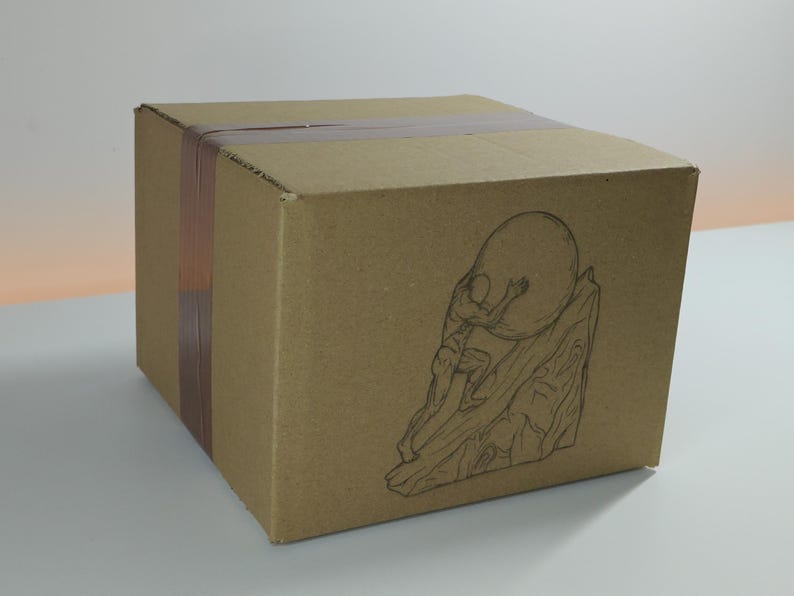 May include: A brown cardboard shipping box sealed with brown packing tape. The front panel features a black line art illustration of a figure pushing a large circular boulder up a steep, rocky incline, capturing a dynamic and detailed scene.