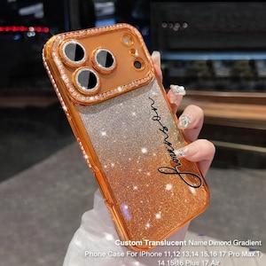 May include: A custom phone case with a gradient design, transitioning from silver to gold, and embellished with sparkling accents. The case features a gold frame and a diamond-like border around the camera. The text "Lonson" is written on the case. The text on the case says: Custom Translucent Name Dimond Gradient Phone Case For iPhone 11,12 13,14 15,16 17 Pro Max 1 14 15 16 Plus 17 Air.