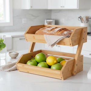 May include: A set of three ceramic mugs with a speckled, matte finish. The mugs are in shades of cream, light gray, and dark gray. Each mug has a simple, minimalist design, perfect for coffee or tea.