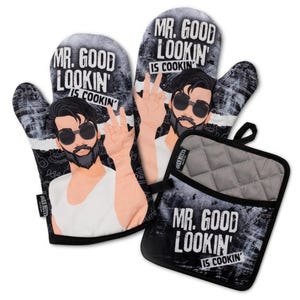 May include: Two oven mitts and a square pot holder featuring a black and white graphic of a bearded person wearing sunglasses, making a salt-sprinkling gesture. The text reads MR. GOOD LOOKIN' IS COOKIN' against a distressed black background.