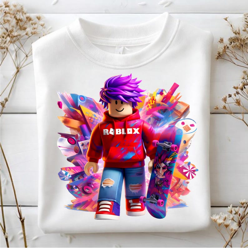 May include: White sweatshirt with a Roblox character in a red hoodie and purple hair, holding a skateboard. The skateboard and background have a vibrant, colourful design. The sweatshirt has a crew neck.