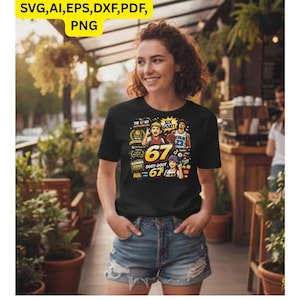 May include: Black t-shirt with a colorful graphic featuring basketball players and the number 67. The shirt includes text that reads "THE 67 KD", "SIX GOAT!", "GAMING ZONE", and "DOOT-DOOT". The shirt is worn by a person in denim shorts.