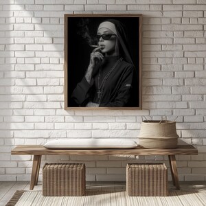 Black-and-white portrait of a nun with a cross necklace for gallery wall — edgy artwork highlighting a provocative theme and rich detail.