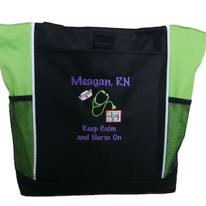 May include: Black tote bag with green accents and a white embroidered design. The design includes a nurse's cap, stethoscope, and EKG reading with the text "Meagan, RN Keep Calm and Nurse On".