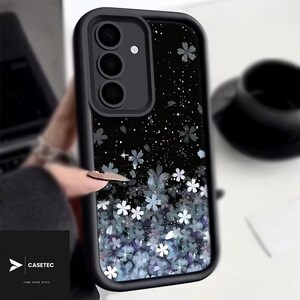 May include: Black phone case with a floral design. The case features a black border and a black background with white and blue flowers. The brand name "CASETEC" is visible in the bottom left corner.