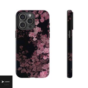 May include: Black phone case featuring a floral design of pink cherry blossoms. The case has a glossy finish and a sleek, modern design. The side view shows the case's slim profile. The brand name "CASETEC" is visible in the bottom left corner.
