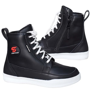 May include: A pair of black high-top boots with white laces and white soles. The boots feature a side zip, a pull tab at the heel, and a circular red and black logo on the side with the text SAVITAR and a small tag reading WATER PROOF.