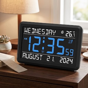 May include: A white ceramic mug with a black handle and the text "But First, Coffee" in a black, handwritten-style font. The mug is on a white surface.