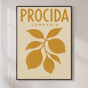 May include: A framed wall art print featuring a cream background with mustard yellow text that reads PROCIDA CAMPANIA ITALY. The center of the print displays a mustard yellow illustration of a lemon branch with three lemons and several leaves.