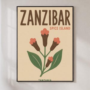 May include: A framed wall art print on a light beige background featuring the text ZANZIBAR SPICE ISLAND in brown and coral, with a central illustration of a clove plant with green leaves and brown stems topped with coral-coloured flower buds.